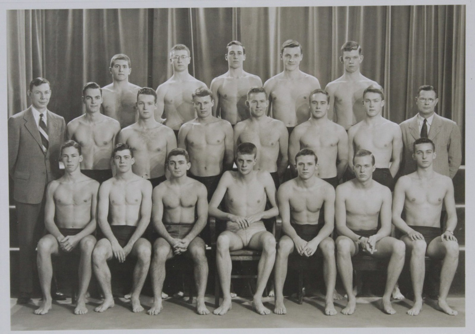 Princeton Swim Team Photo / Orren Jack Turner: Circa 1950's Princeton Unversity swim team posed in swim suits."ORREN JACK TURNER PRINCETON NEW JERSEY" blind stamp lower right margin. Clear sharp image in very good conditio. Black wood frame with g
