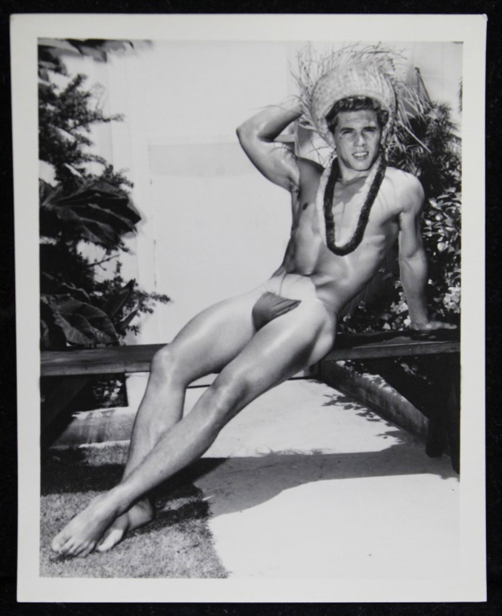 Bruce of Los Angeles Male Physique Photograph: Vintage original 4" x 5" Bruce Bellas / Bruce of Los Angeles photograph of model David Zurborg posed outdoors leis and straw hat. Stamped "Bruce 2046-6". Clear sharp image on double weight textured pa