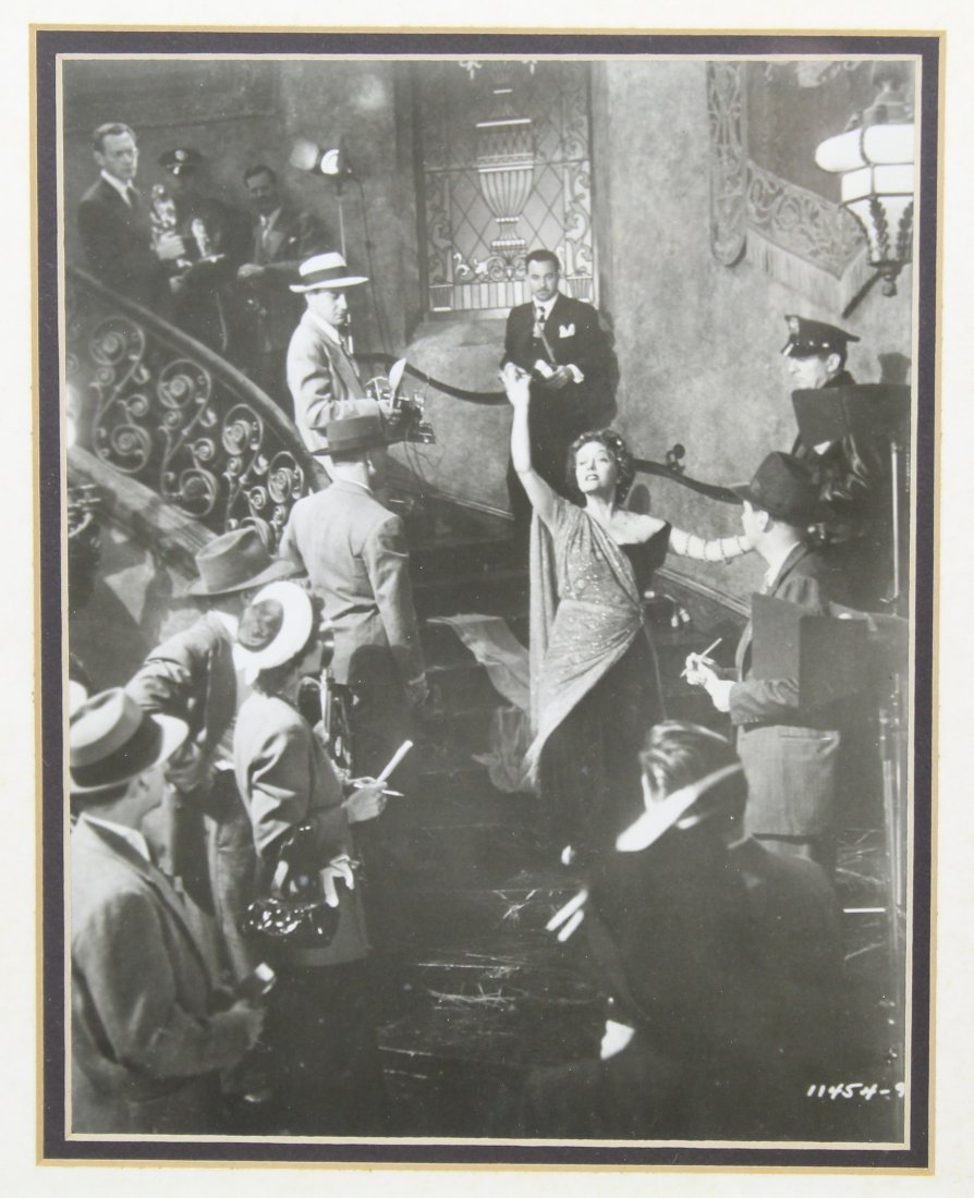"Sunset Boulevard" Original Hollywood Movie Still Photograph: Vintage black and white still photograph of the ending staircase scene of "Sunset Boulevard". In negative number 11454-9 lower right. Lighter tone print in slightly soft focus. Appears in good conditi