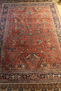 Vintage Persian Gorevan Serapi Heriz Rug: Classic designs on mellow brick red field surrounded by a blue border. Appears in very good condition with expected light pile wear, etc. Fringe ends professionally repaired / conserved. 9' 6.5" x 12'