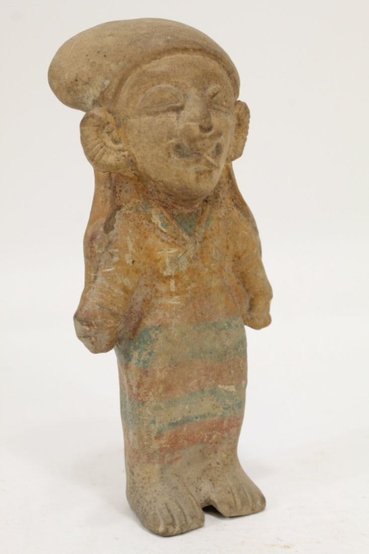 Pre-Columbian Manabi Equador Clay Figure: Standing clay firgure with painted details to clothing. Old typewritten label to the reverse. Good condition with expected signs of age, small nick chips, etc. No apparent cracks or repairs. 7.5" H ap