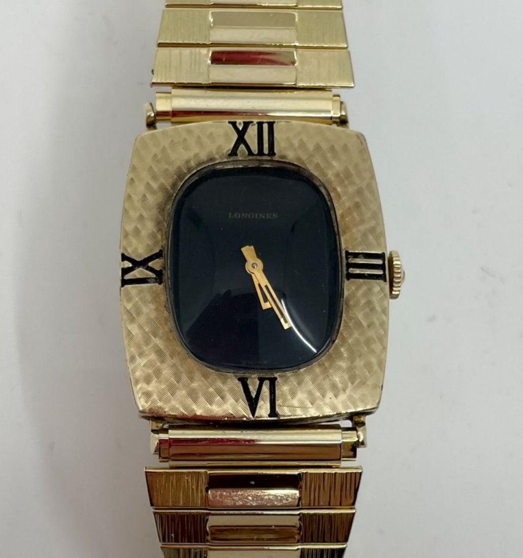Vintage Longines Men's Gold Tone Dress Watch: Vintage Longines Men's Gold Tone Dress Watch. 17 Jewel movement marked 528. 29x25mm 10K gold filled case with debossed roman numerals and brushed finish, newer gold tone stainless stretch bracelet. Wi
