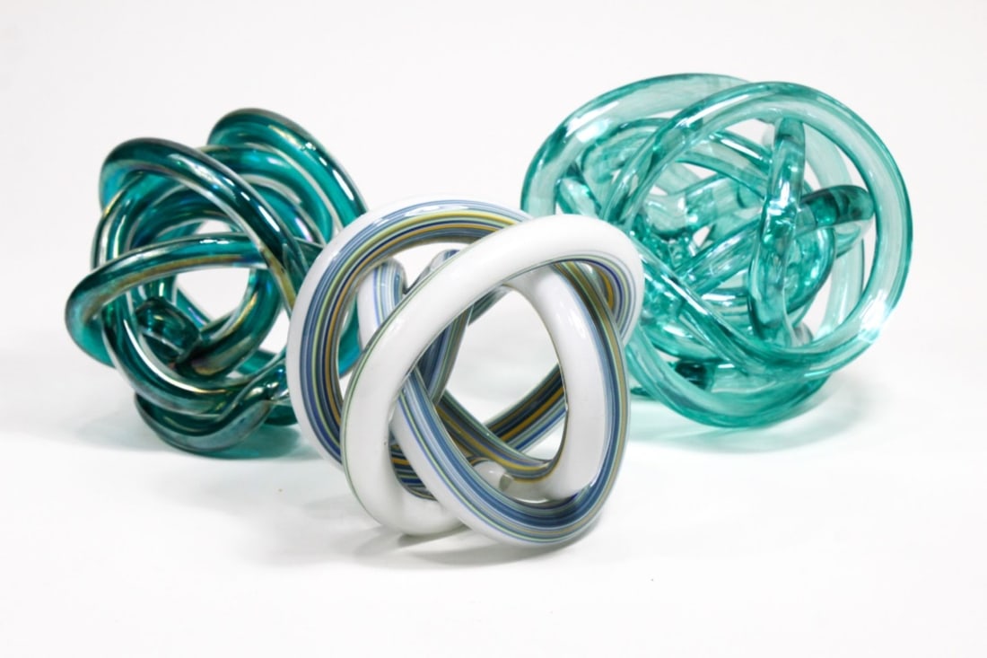 Art Glass Knot Sculptures Group 3: Group of 3 art glass knot sculpture each hand twisted from a single glass rod. Excellent condition. Largest 5" dia. approx.