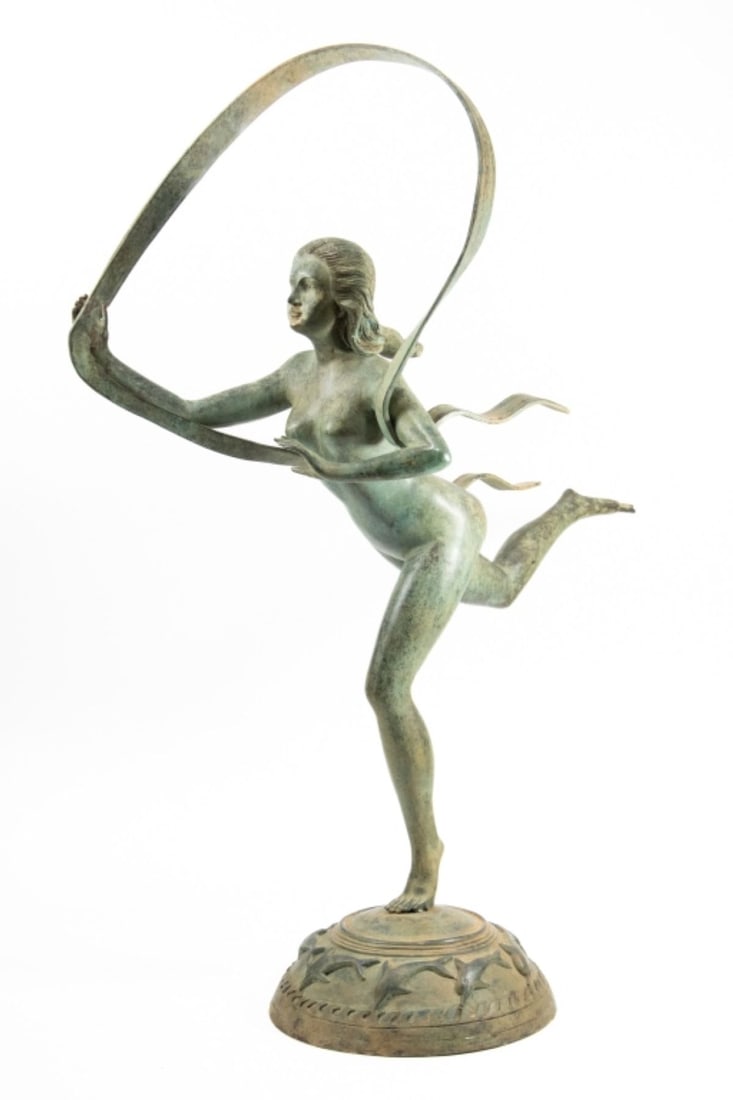 After Paul Manship "Atalanta" Bronze Sculpture: After Paul Howard Manship (1885-1966 New York) "Atalanta" Patinated Bronze Sculpture. Unsigned. A tabletop sculpture of Greek Goddess Atalanta, Princess of Arcadia, holding a ribbon as she strides, at