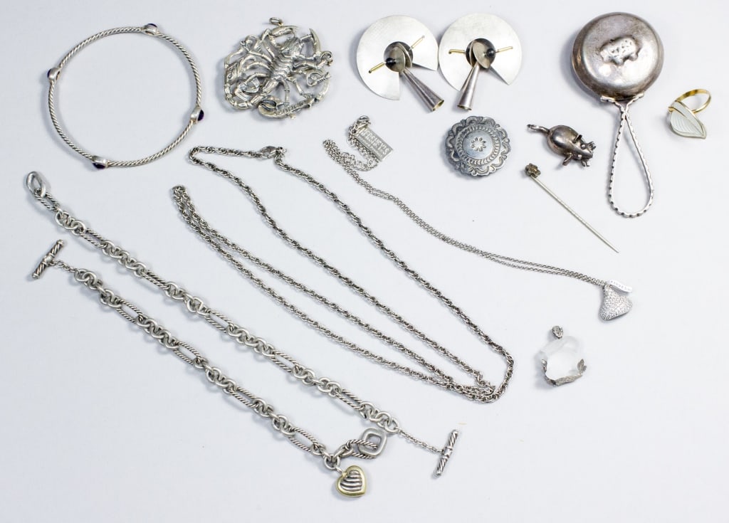 David Yurman Sterling Jewelry & Others: (1) David Yurman bangle with 4 bezel set amethyst marked D.Y. 925, and 2 David Yurman chain bracelets with toggle clasps, one with a small silver heart stamped DY at center, marked D.Y. 925 750, and t