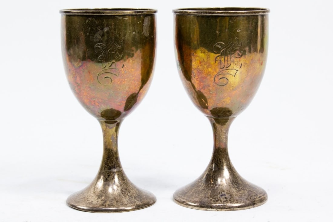 Pair Mulholland Brothers Sterling Goblets: Pair Mulholland Brothers Sterling Goblets. Marked on base. Hand engraved Old English font "E" monogram. Hand hammered finish. Measures 6x3" each. Very good condition. 324g TW