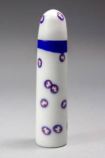 Richard Marquis Nobel Effort Core Vessel 1983 Pilchuck Artist: Satin finished white glass lidded vessel / vial inset with red/ blue/ white "Scottie Dog" silhouette murrini pieces. Signature murrine plaque to bottom with 1983 date. Cork stopper to lid. Includes or