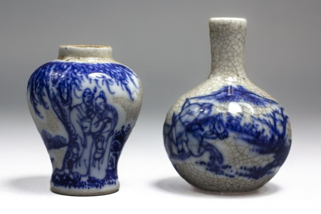 2 Chinese Crackle Ware Miniature Pottery Vases: 2 Chinese crackle ware underglaze blue miniature pottery vases. Design of a traveler and 2 scholars in a grove. 2 character marks to the base of each. 1 missing lid and glaze misses , light surface we