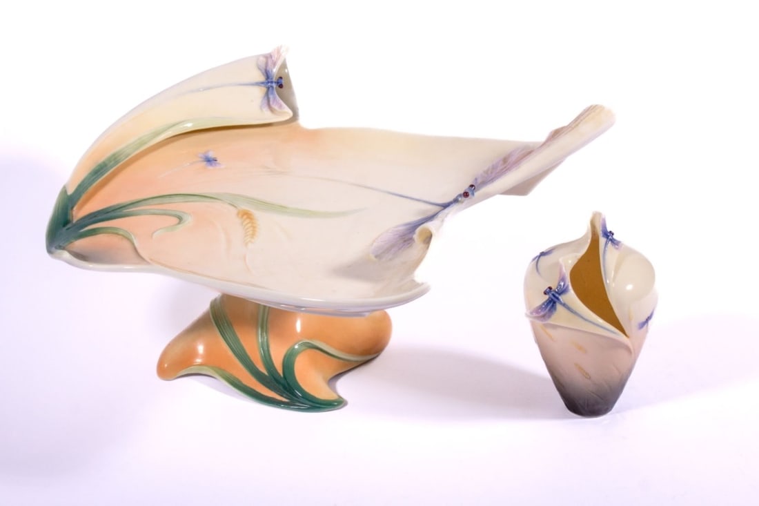 Franz Porcelain Dragonfly Cake Platter & Bud Vase: Franz porcelain dragonfly pattern cake platter and bud vase. Moulded dragonflies among grasses. Both pieces in good condition. Platter measures 4.25" H x 12" across at widest point approx., vase 5" H 