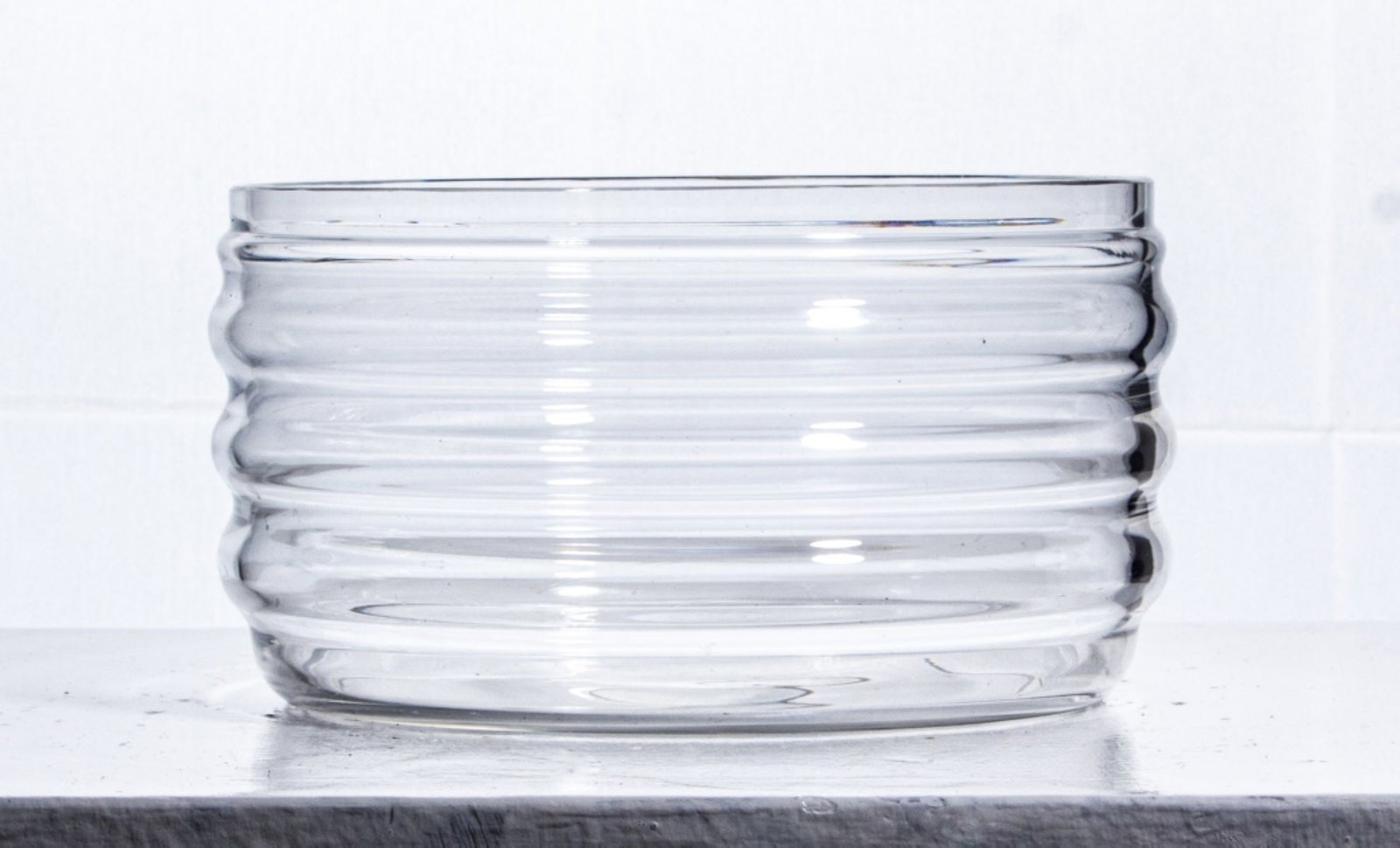 Baccarat France Art Deco Style Crystal Bowl: Baccarat France crystal bowl with ribbed sides in Art Deco style. Acid etched mark to bottom. Excellent condition with some light shelf wear to bottom. 4" H x 6.75" dia. approx.
