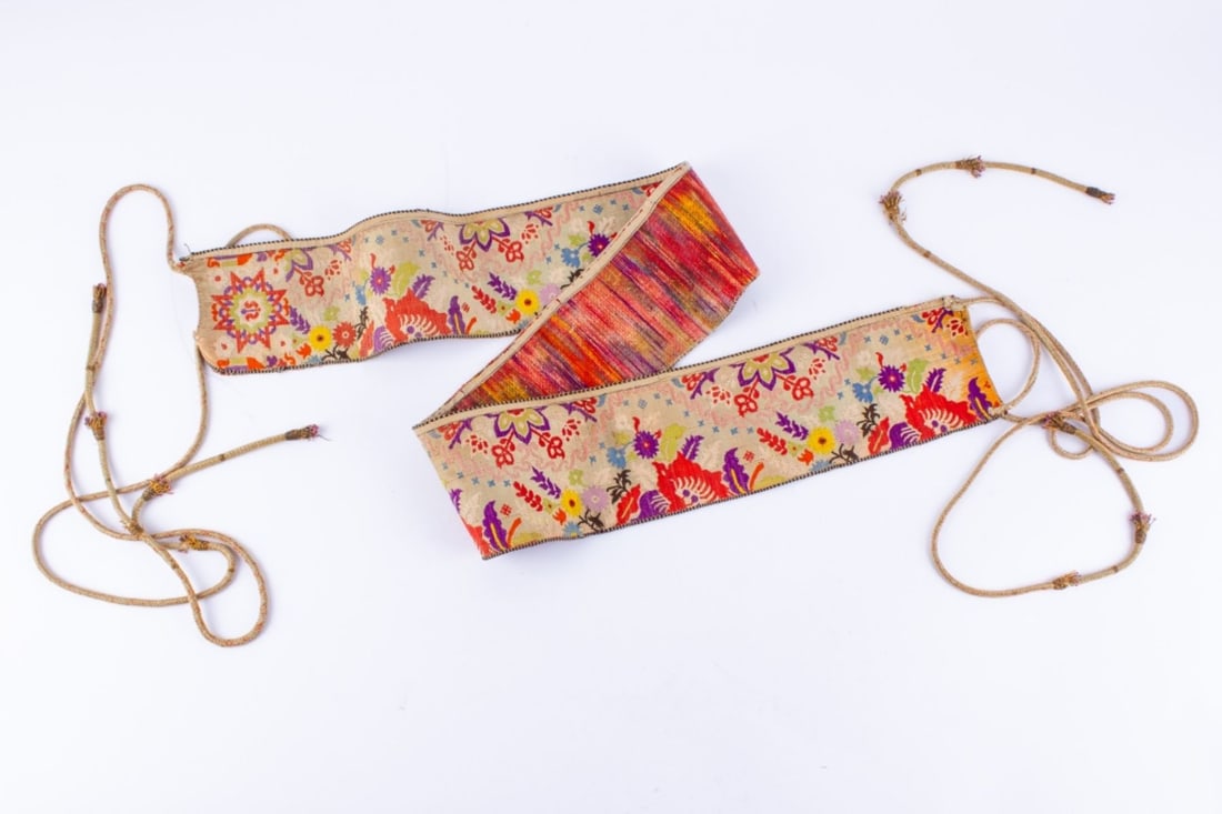 Antique Moroccan Hizam Wedding Sash: Antique Moroccan Hizam wedding sash. Woven with silk, with star design leading to a continuous floral pattern in bright colors; two woven cords at each end with tassels of pink beads extruding. Likely