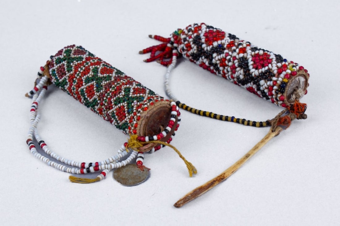 2 Timor Beaded Lime Container Betel Nut 1920's: 2 powdered lime containers with hand-woven seed beads from West Timor Island ,Indonesia and bead strings. These containers held the powdered lime, which was added to the betel quid.one with bird wing 