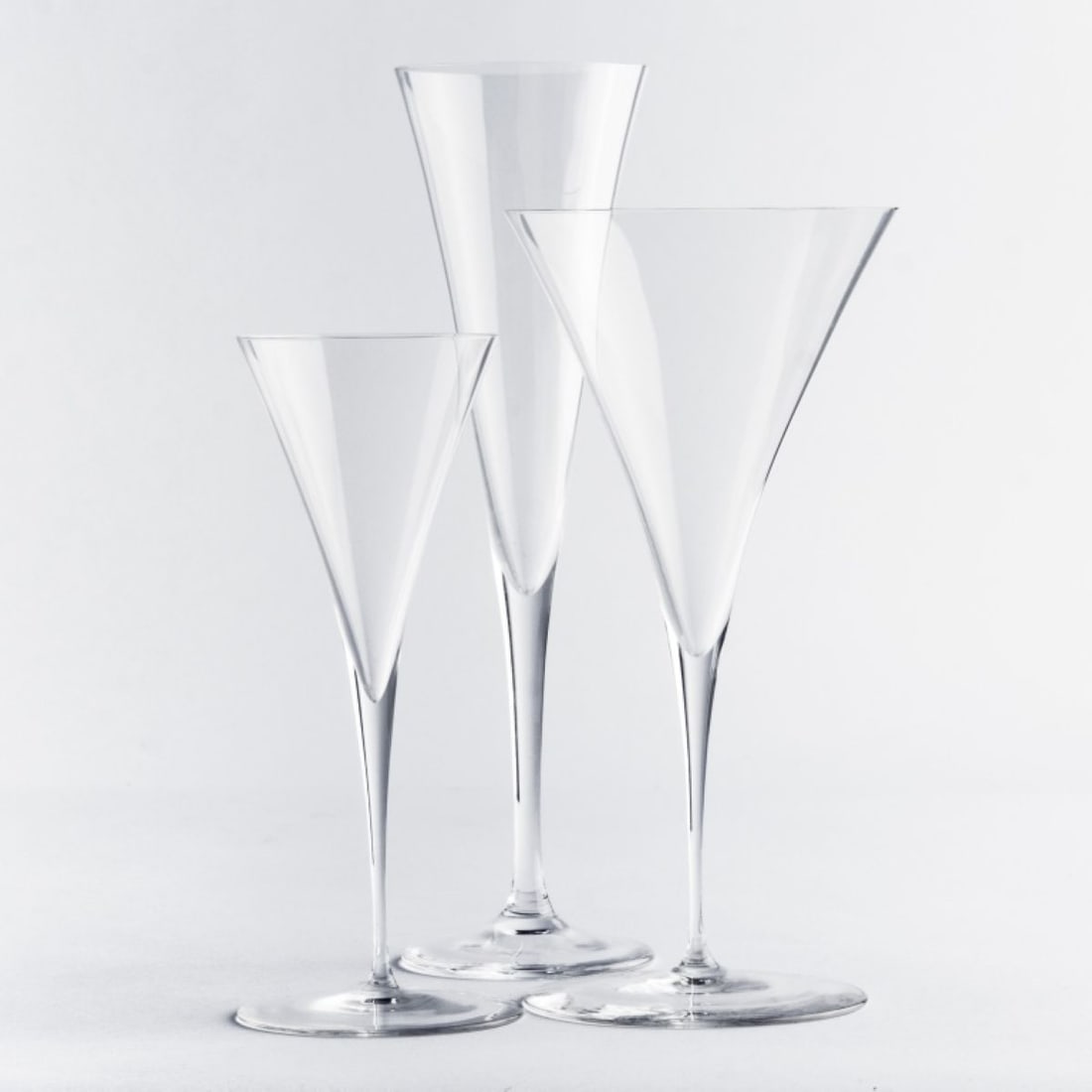 Lobmeyr AMBASSADOR Goblet Stemware Glasses: Group of Lobmeyr "Ambassador" pattern mouth blown crystal stemware designed by Oswald Haerdtl in 1925. Includes 3 red wine stems (7.75"), 5 champagne flutes (9.25"), and 3 sherry / cocktail stems (6.5