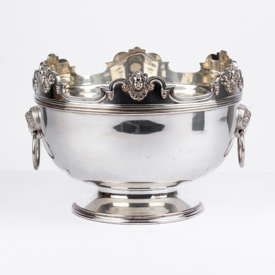 Antique Sheffield Wine Cooler / Punch Bowl: English Neoclassical style silver plate on copper footed wine cooler / punch bowl with cast ram head and ring handles. Removable rim ("clicks" into place) cast with cherub / putti faces. Mark for Ewar