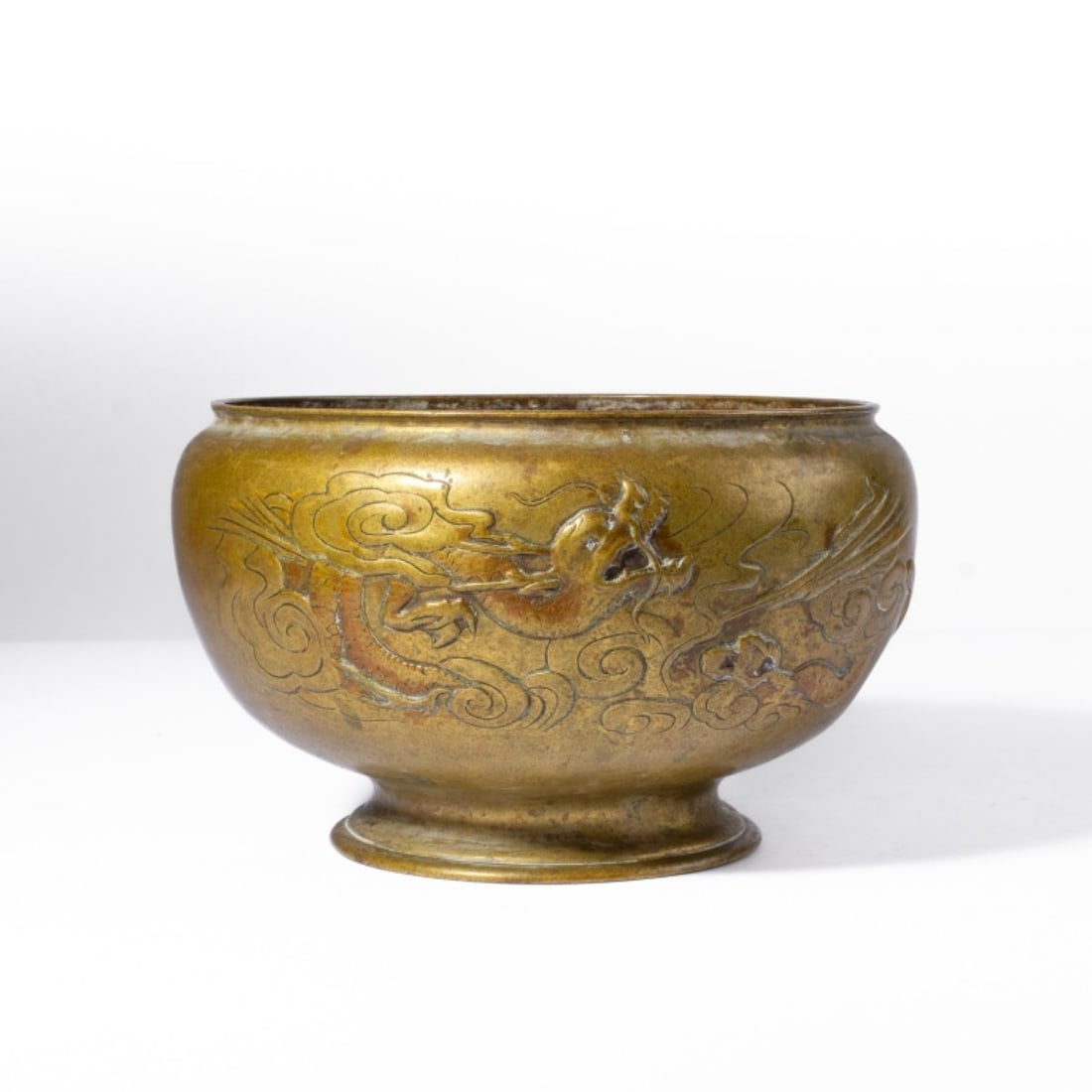 Antique Japanese Cast Bronze Dragon Vessel: Antique Japanese Cast Bronze Dragon Vessel. Probably Meiji Period. Cast With dragon among clouds mirrored on both sides. Paper label at base. Some wear from use; one small dent. Measures 4.75" tall, 7