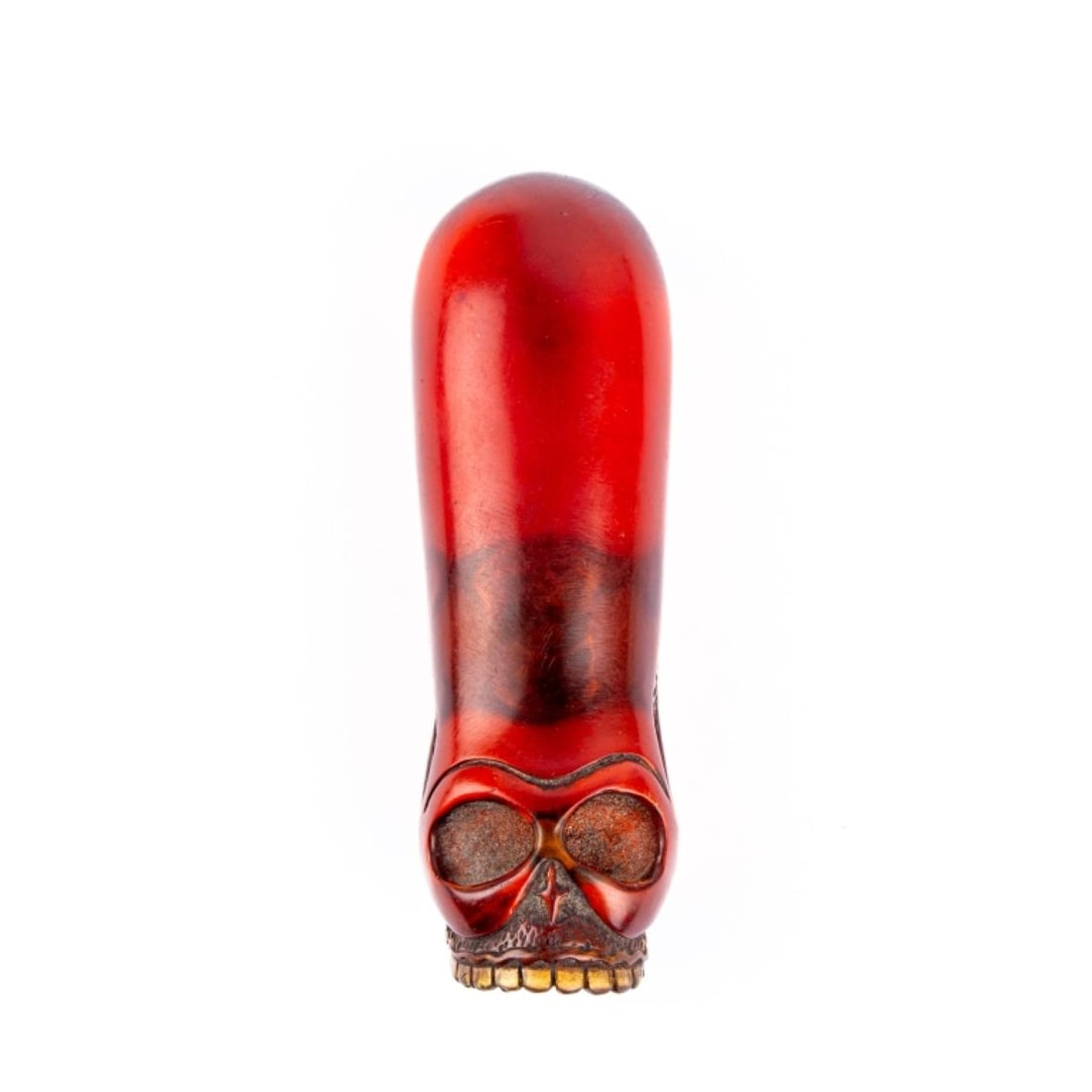 Japanese Carved Amber Netsuke of a Skull: Japanese Carved Amber Netsuke of a Skull. Finely carved elongated cranium with details to teeth, underside of jaw and temples. Unsigned. In very good condition. Measures 2.25" across approx.