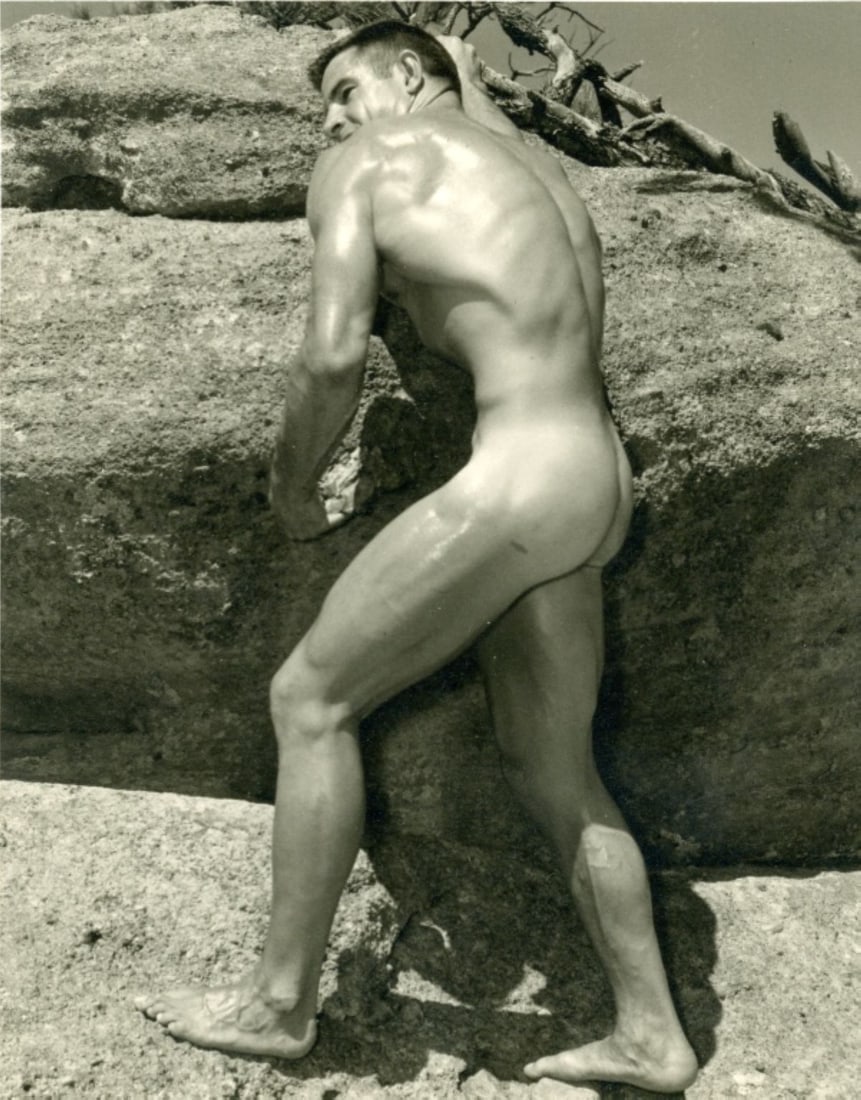 Western Photography Guild WPG Physique Photo: Original Don Whitman / WPG photograph of bodybuilder Ray McGuire (Mr. Colorado 1956) posed outdoors standing in front of a boulder. Stamped Western Photography Guild BOX 2801, DENVER, COLO. along with
