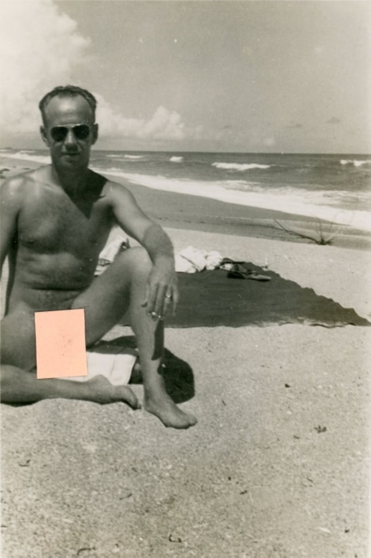 Vintage Amateur Male Nude Photograph: Circa 1950s amateur snapshot photo of a nude man wearing aviator sunglasses on beach. Clear image printed on gloss paper. Good condition. 4.5" x 3.25".