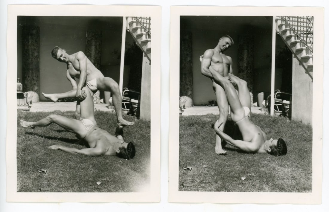 Bob Mizer AMG Nude Male Photos / Dave Wiler: Two vintage original AMG photographs of two models wrestling outdoors at Bob Mizer's compound; from the estate of the dark haired model pictured. Pencil written 12 and 13 to the backs. Good sharp imag