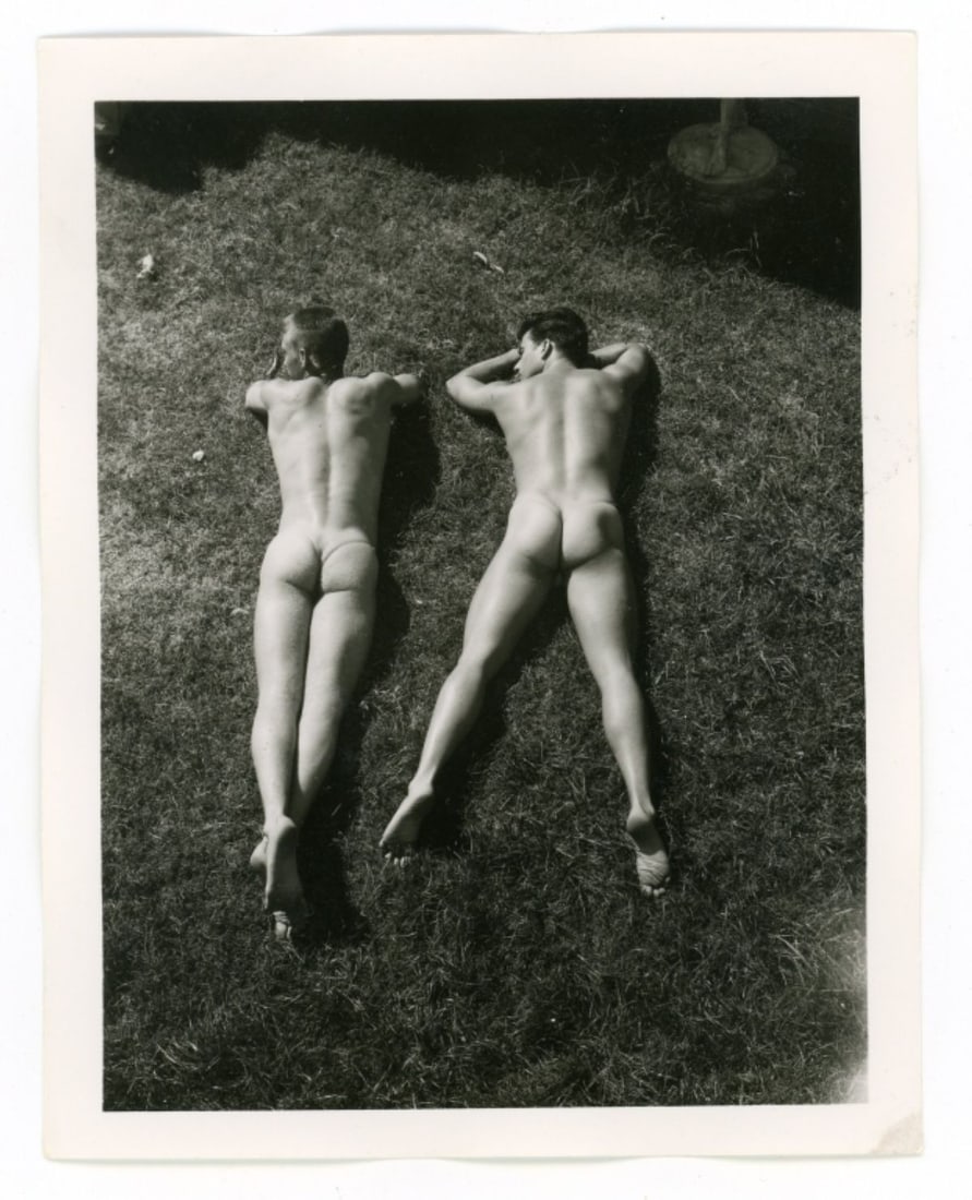 Bob Mizer AMG Nude Male Photos / Dave Wiler: Vintage original AMG photograph of two models wrestling outdoors at Bob Mizer's compound; from the estate of the dark haired model pictured. Pencil written 25 to the back. Good sharp image printed on