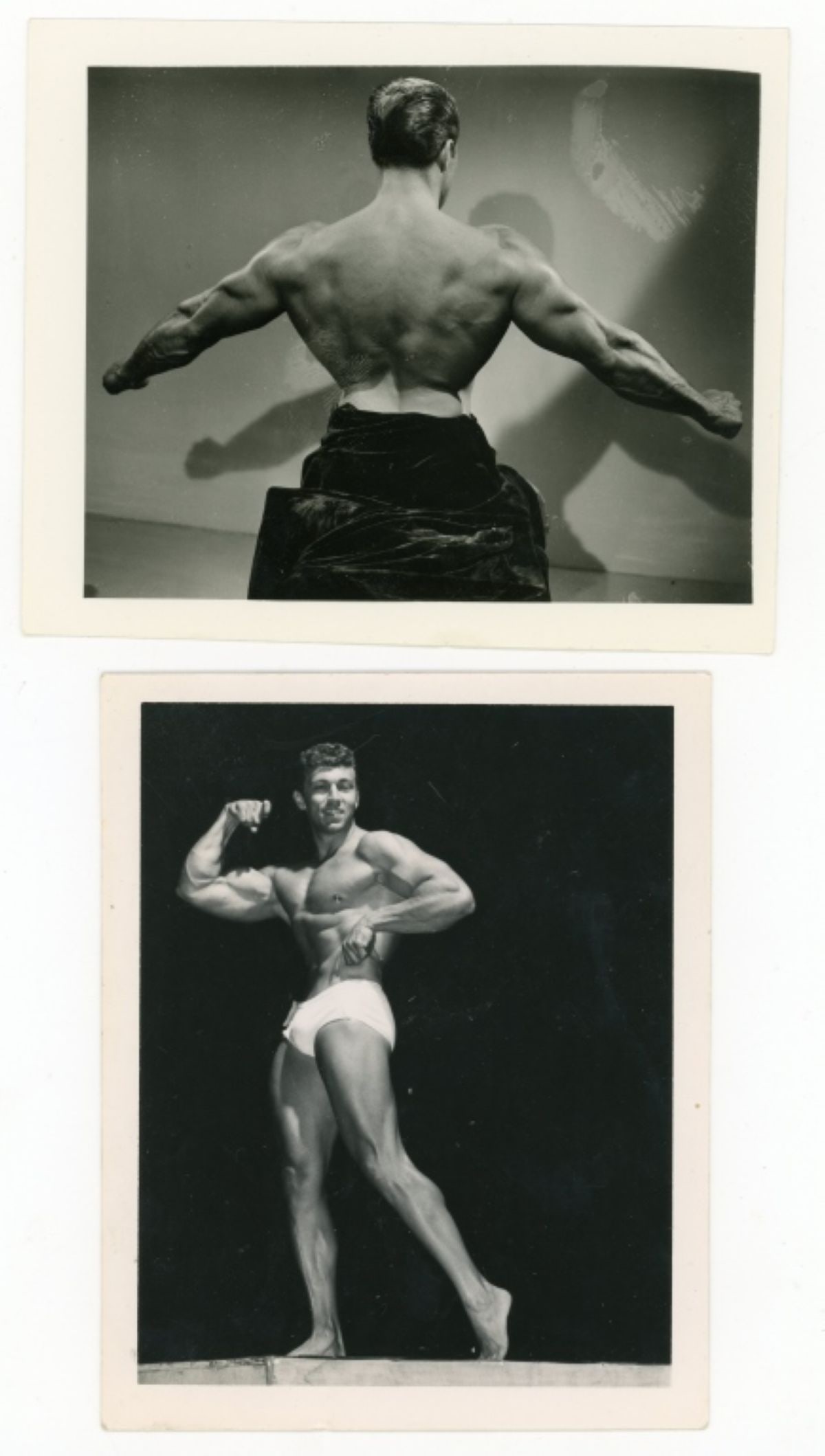 Bob Mizer AMG Bodybuilder Photographs: Two original Bob Mizer / AMG of bodybuilders. One posed in studio flexing back muscles (possibly Ed Fury) and one posed on stage. Clear sharp image on gloss paper. Good condition. Some darkroom develo