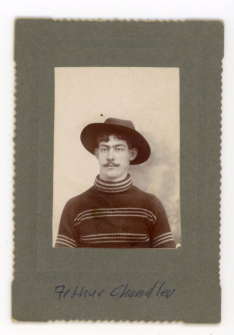 Small Cabinet Card of Man with Hat, late 1800's: Small Cabinet Card of Man with Hat, late 1800's. Striking portrait of young man with moustach, striped knit sweater, and felt hat. Photo measures 2.5x1.75" on 4x3" cardstock backing with frenched side