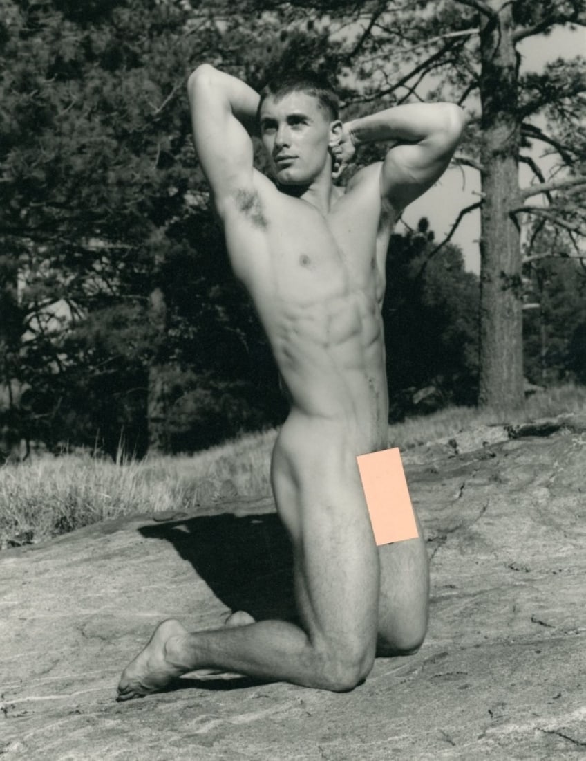 Paul Burkhart (CA) Male Nude Art Photograph: Male nude figure posed outdoors on knees with arm behind head. Pen signature and Burkhart studio stamp to the reverse. Clear sharp image on slightly textured doubleweight satin paper. Excellent condit