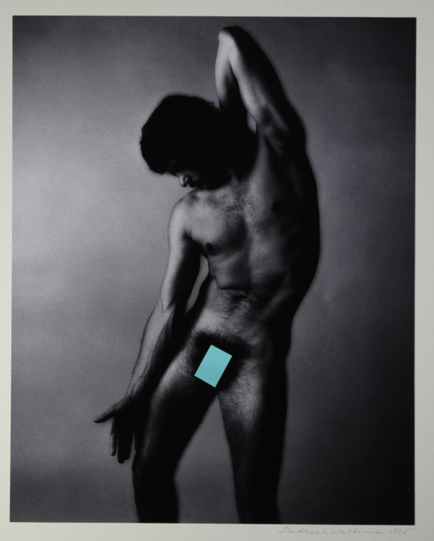 Shedrich Williams (OR) Photograph Male Nude 1975: Untitled; male nude standing. Gelatin silver photograph mounted to mat backing. Pencil signed and dated 1975 to mat lower right. Photograph 12.5" x 10". Mat 20" x 16". Small water stain to upper left 