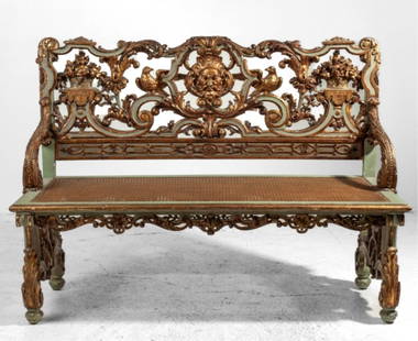 Maison Forest Paris Carved Parcel Gilt Bench: Late 19th century Maison Forest Paris carved Rococo style gessoed and parcel gilt banquette bench. Back carved with center greenman face, birds, and flower urns. Legs and seat frieze with shells. Wove