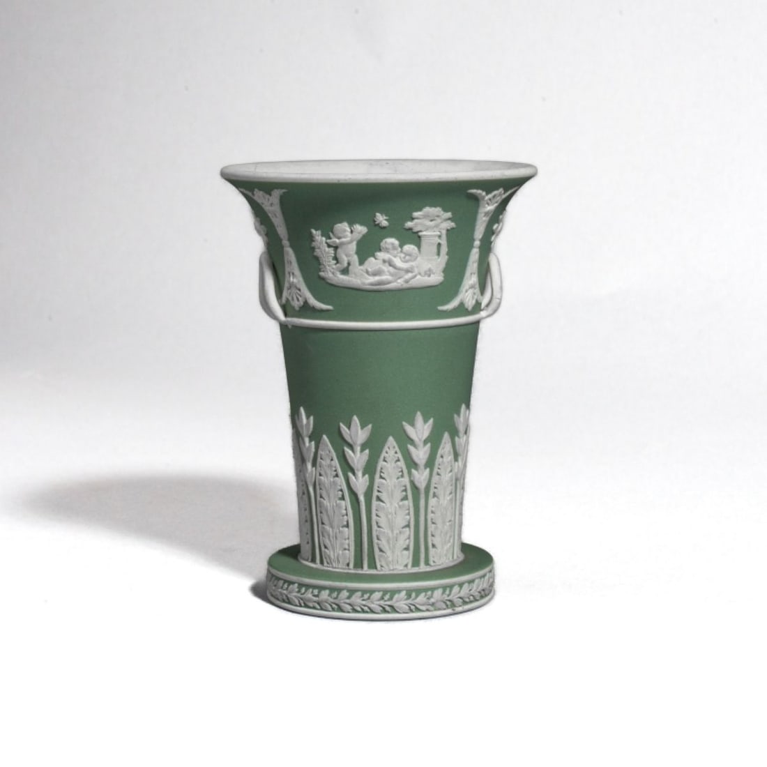 Wedgwood Green Jasper Trumpet Vase w/ Handles: 19th century Wedgwood sage green jasper trumpet vase with applied handles. Impressed WEDGWOOD mark to bottom. Good condition: interior with some small stain spots, small scratch, etc. 4.5" H x 3.25" l