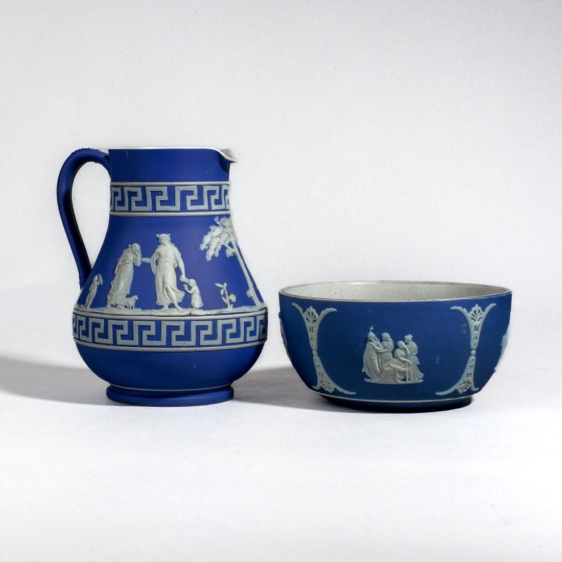 Wedgwood Jasper Bowl & Pitcher / Jug: 19th century Wedgwood blue jasper bowl and jug pitcher. Both with impressed WEDGWOOD marks along with the number 30. Good condition; some surface dirt, etc. Bowl 2.5" H x 5.25" dia. Pitcher 6" H.