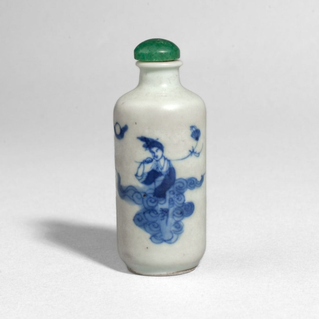 Chinese Kangxi Blue & White Porcelain Snuff Bottle: Chinese Kangxi Blue & White Porcelain Snuff Bottle. Of wide cylindrical form with painted immortal standing on a cloud in underglaze blue. Jade/hardstone stopper. Four-character Kangxi mark at base. I