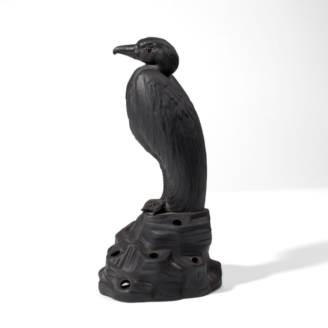 Wedgwood Black Basalt Ernest Light Flower Frog: Wedgwood Black Basalt Crane on Rock Flower Frog. Designed by Ernest Light. Circa 1920. Black basalt jasperware with glass eyes. Impressed "WEDGWOOD" and "MADE IN ENGLAND" marks. Beak replaced. Measure