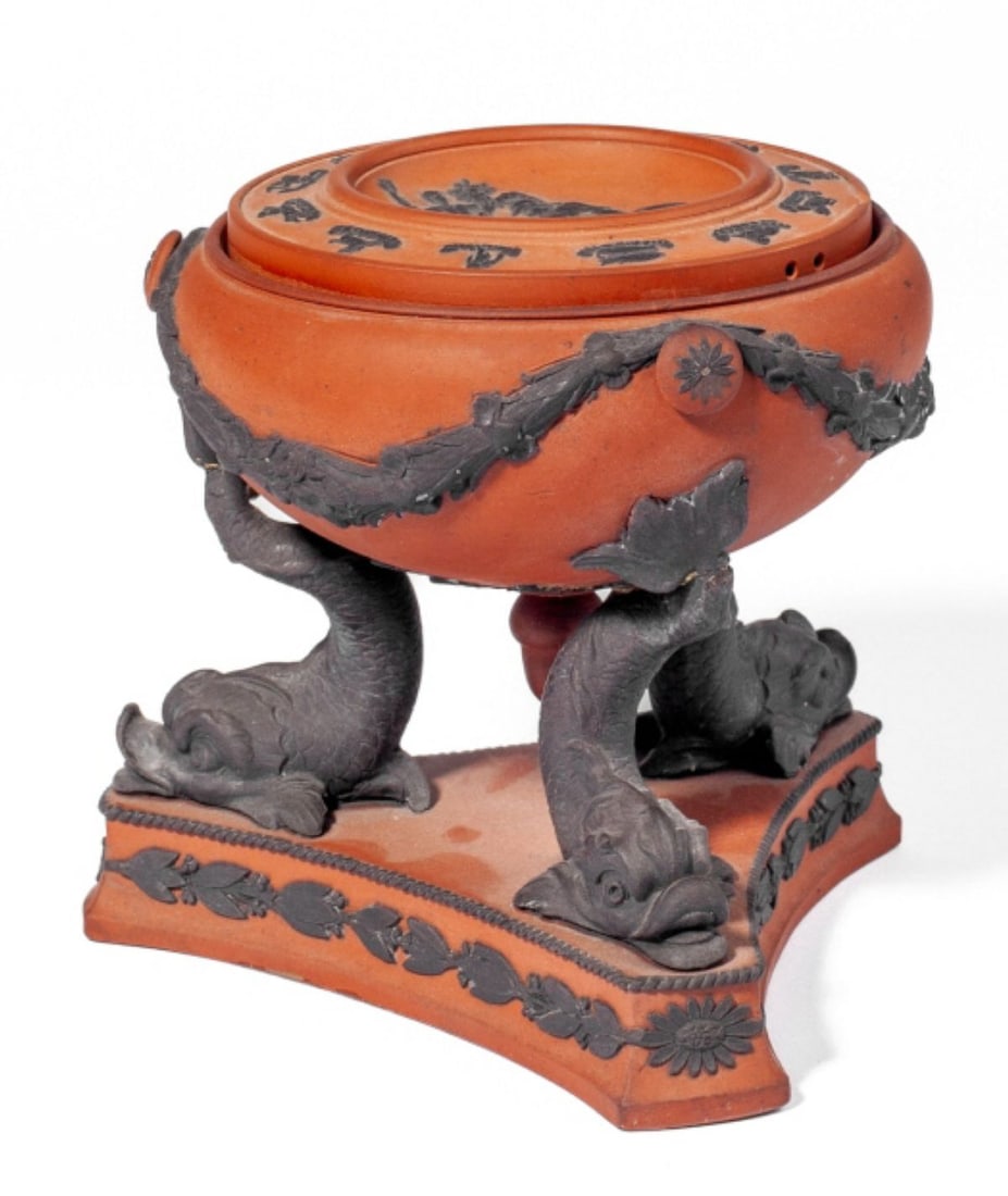 Wedgwood Rosso Antico Dolphin Tripod Burner: Wedgwood Rosso Antico Dolphin Tripod Pastille Burner. Early 19th century. Pastille burner held by three grotesque dolphins on base with applied laurel below. Early "WEDGWOOD" mark at base. Break repai