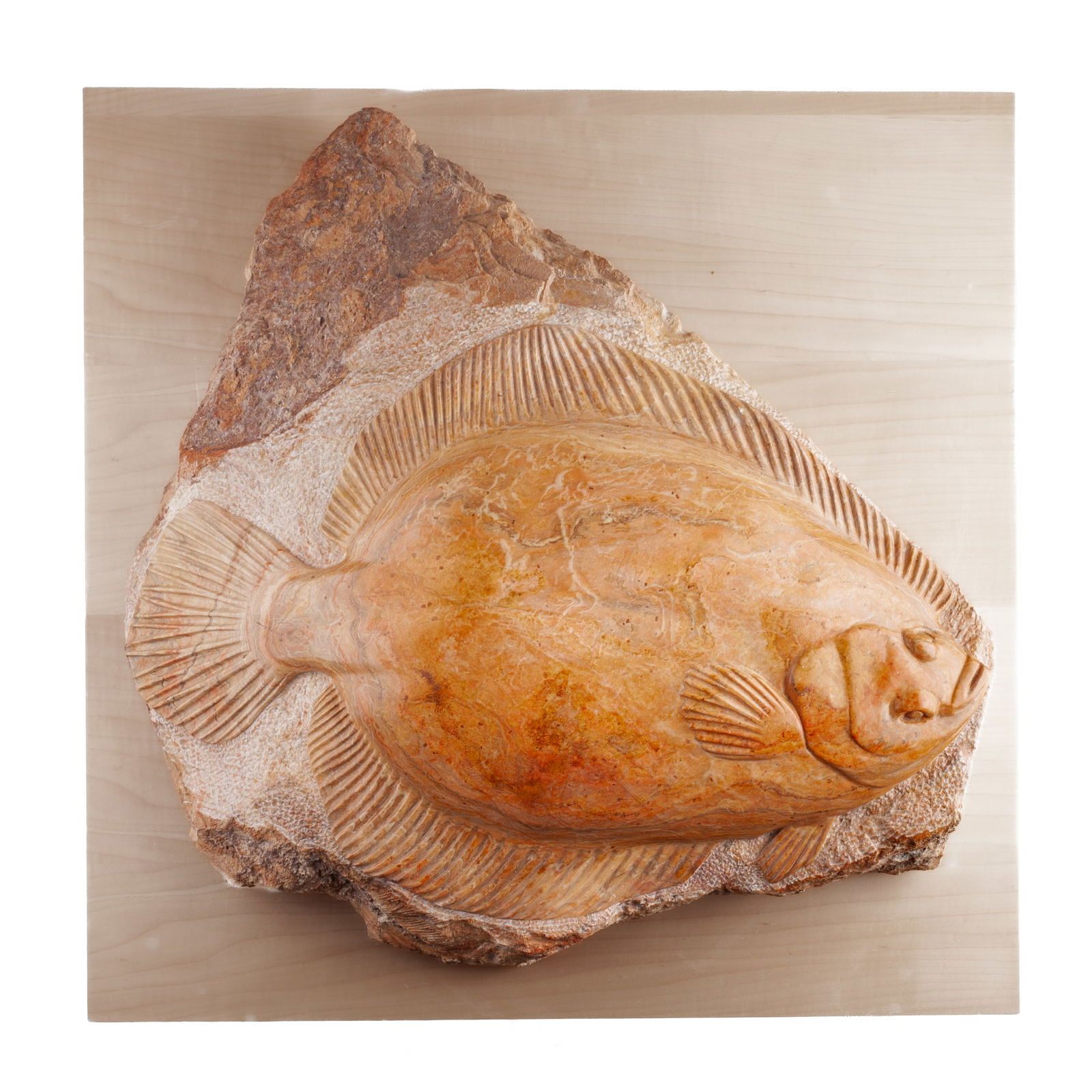 Tony Angell (WA) "Sea Form" Marble Sculpture, 1997: Tony Angell (b.1940 Washington) "Sea Form" Carved Marble Sculpture, 1997. Signed on side. Depicts halibut fish curved over rock surface. Measures 7 x 30 x 24". Excellent condition.