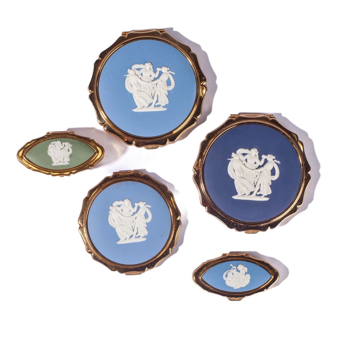 Wedgwood Jasperware Compacts / Lipstick Holder: Collection of Stratton Wedgwood jasperware compacts and mirrored lipstick cover ("Three Graces" plaques) and pill box (cherub plaque). All appear from lightly used to unused condition. 5 pieces total.