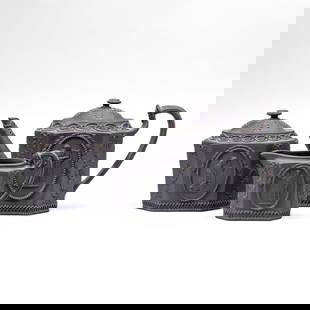 Wedgwood Black Basalt Muses Tea Set: 3 piece tea set of early 19th century Wedgwood black basalt. Includes teapot, lidded sugar bowl and creamer all of octagonal form, with applied muses playing the lyre between festoons and below scroll