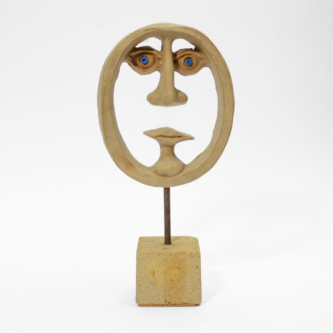 David Gil for Bennington "Face" Ceramic Sculpture: David Gil (1922 - 2002) for Bennington Potters "Face" ceramic sculpture. Carved from buff ceramic with applied pigment to eyes. Stamped signature "DG"; "BENNINGTON POTTERS BENNINGTON VERMONT 1935" at