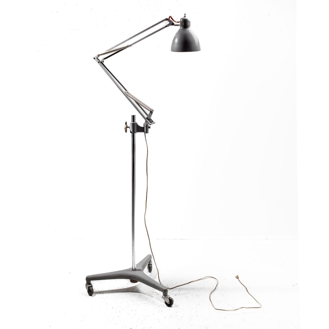 Luxo “Naska Loris?? Rolling Lamp: Luxo “Naska Loris” Rolling Lamp, circa1950's. Designed by Jac Jacobsen, founder of Luxo. Lamp arm marked LUXO LAMP L-1 and NORWAY. Grey paint to shade, arms, and base. Measures approx 77x20x20