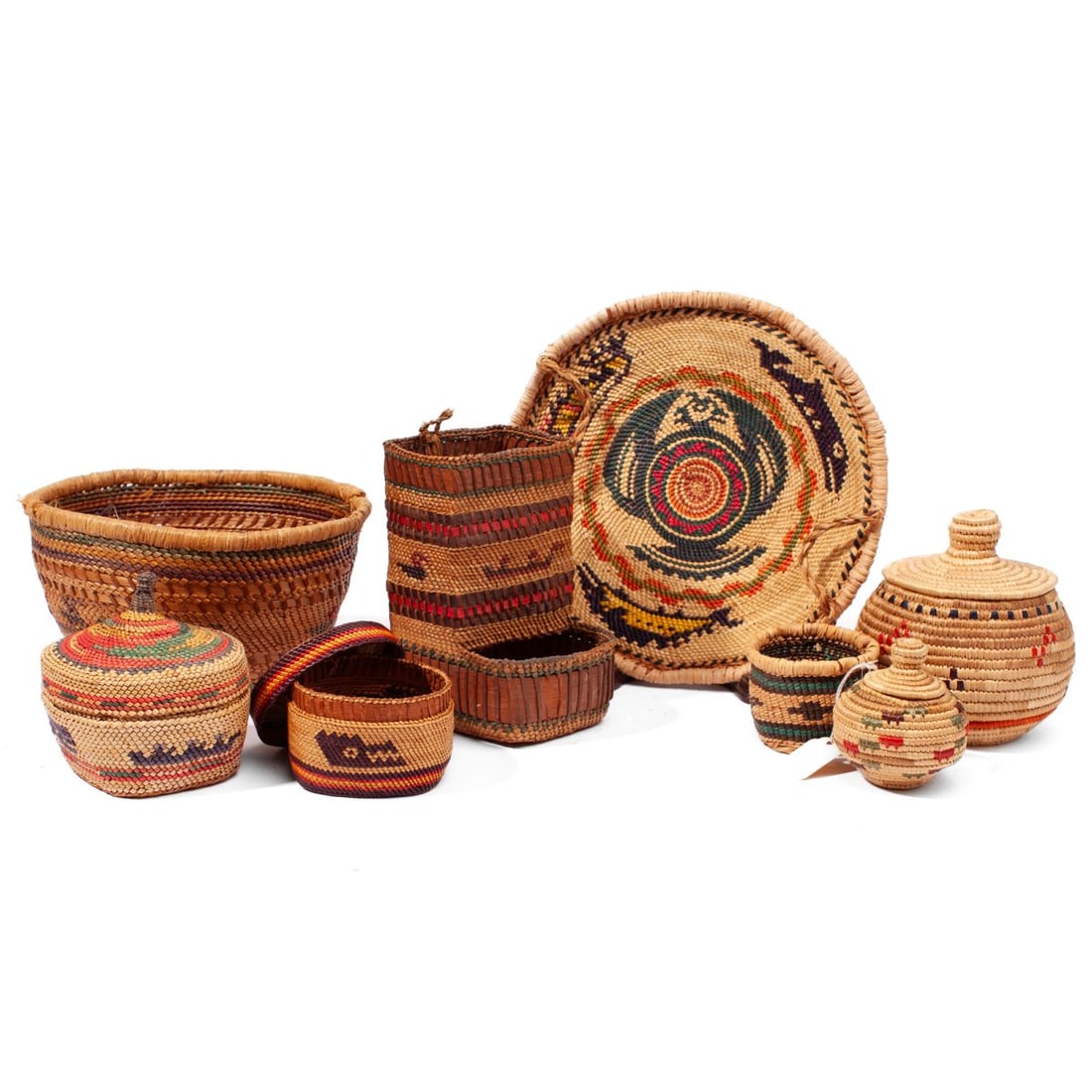 Group of 8 Makah Baskets: Group of eight Makah baskets. (1): A basket match holder with waterfowl and canoe between strips of dyed bark. In very good condition. 5.75" x 3.5". (2): A small lidded basket with crocodile. In very 