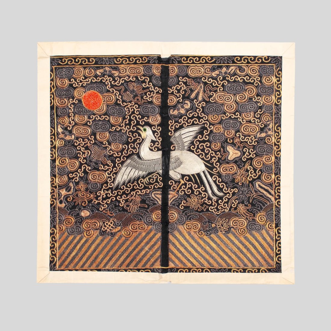 19th C. Chinese Embroidered Silk Rank Badge: Chinese embroidered silk rank badge. Late 19th century. Depicting silver pheasant over indigo-dyed silk ground among stylized waves, clouds and auspicious emblems in gold and silver-tone metallic couc