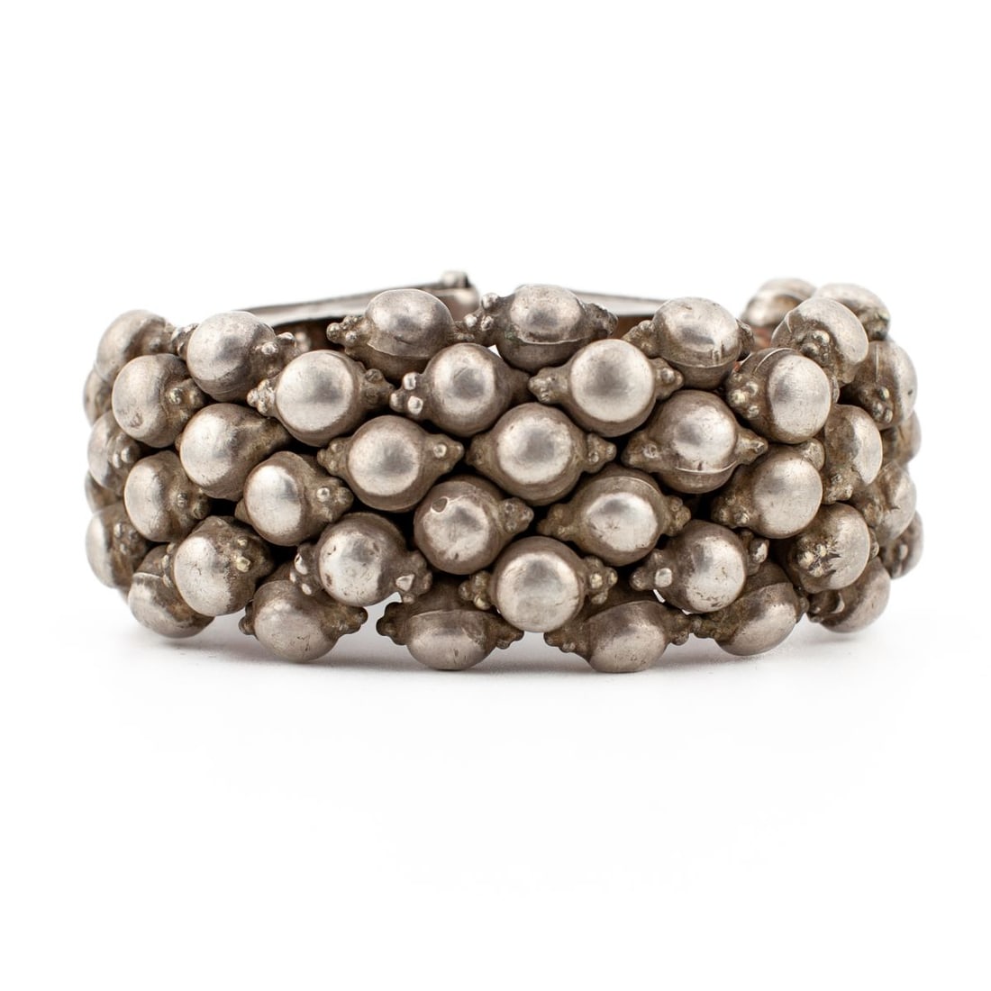 Indian Rajisthani Granulated Silver Cuff: Antique Indian cuff from Rajisthan, the wrapped fibrous base covered with granulated silver beadwork, with granular clasp ends joining together via a pin. Stamped "MR S.N." under one end. Appears in v