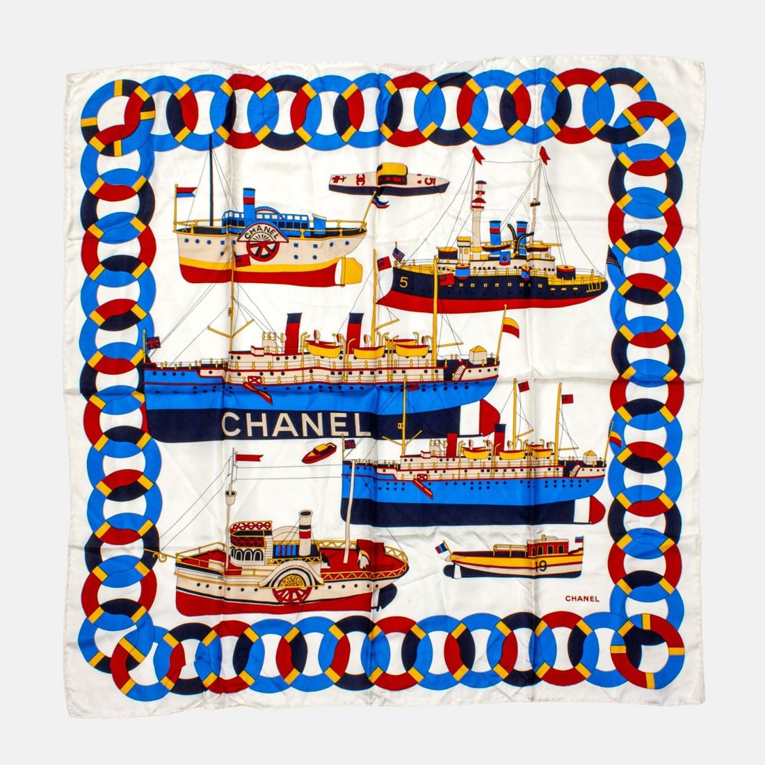 Chanel Ship Design Silk Scarf: Chanel silk scarf with cruise ship/ battleship/ boat design on cream background. Hand rolled and stitched edges. Original MADE IN ITALY tag. Appears in very good condition. 37" x 37" approx.