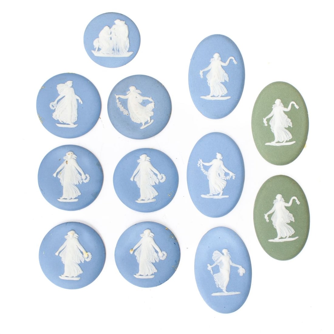 12 Wedgwood Jasper "Dancing Hours" Cameos: Twelve Wedgwood jasperware cameos with maidens dancing in white; ten of blue jasper and two of green. Each with impressed "WEDGWOOD MADE IN ENGLAND" marks. Adhesive paste to reverse; otherwise all are