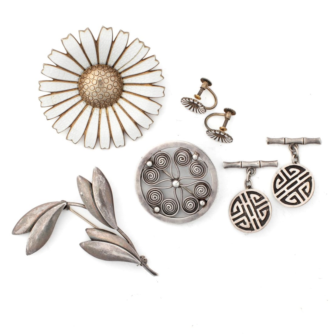 Mid Century Modernist Sterling Jewelry / Denmark: (1) Anton Michelsen gilt sterling and enamel daisy flower pin (2" dia.) and matching screw back earrings (3/8" dia.). Stamped with AM hallmarks STERLING DENMARK. (2) Jens Tage Hansen leaf style pin. S