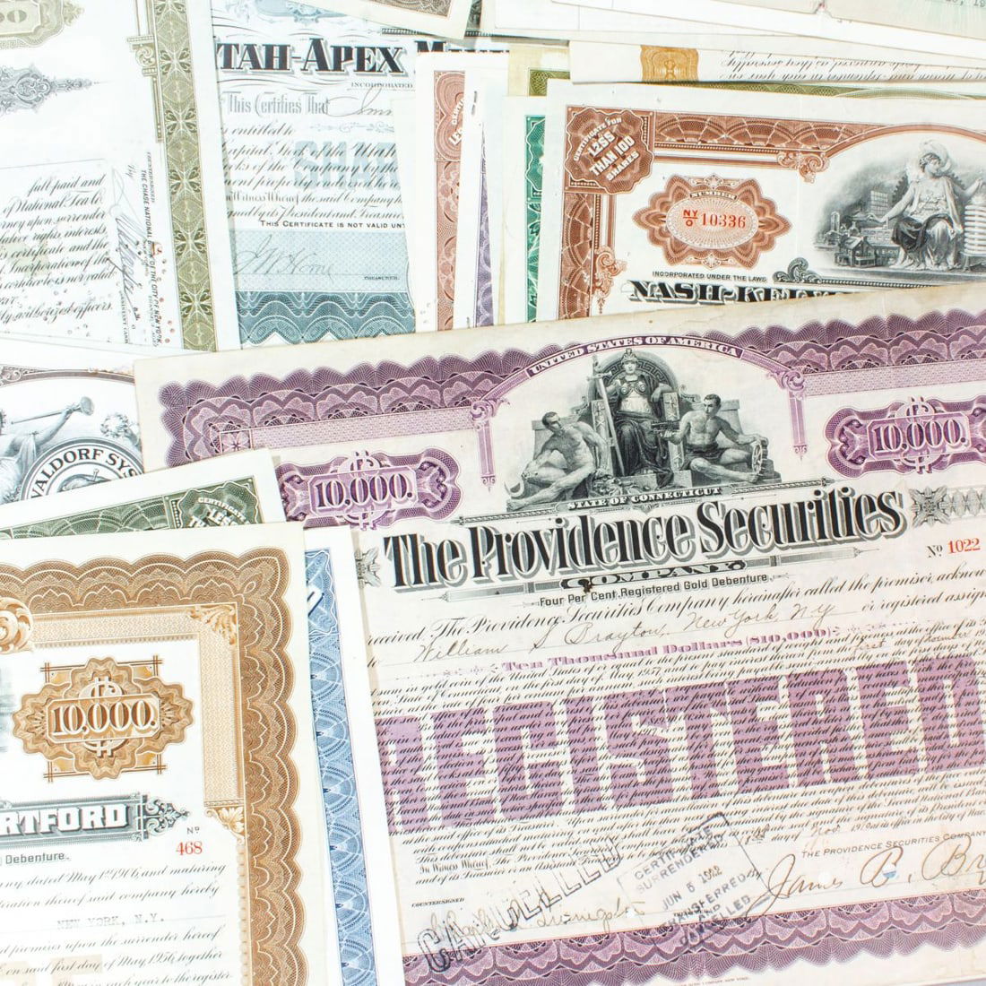 Collection 60+ Antique Stock Certificates: Collection 60+ Antique / Vintage Stock Certificates. Majority consisting of various mining and railway companies. Late 19th - mid 20th century examples, many with handwritten signatures. Most in good