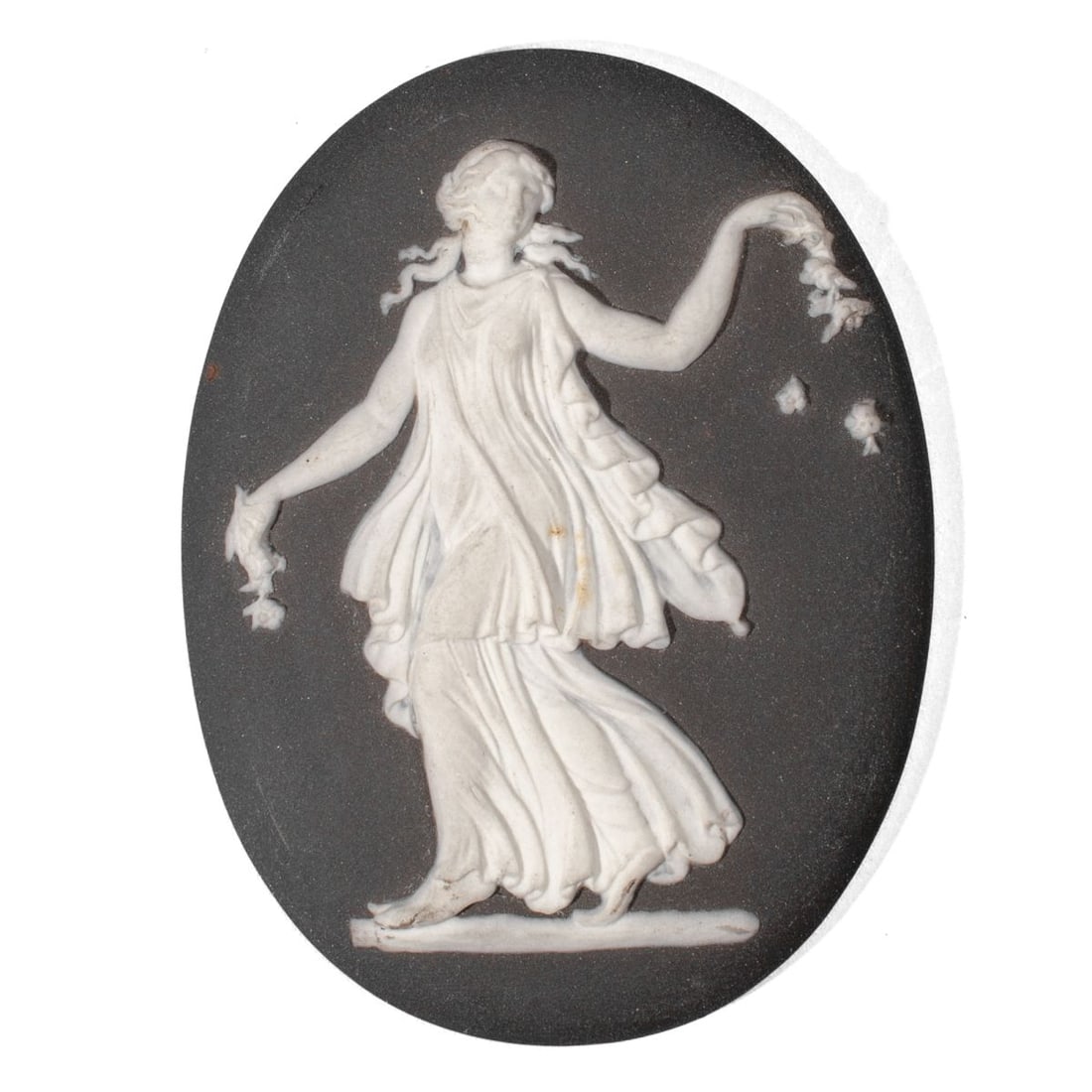 Wedgwood Black Basalt "Dancing Hours" Plaque: 19th century Wedgwood plaque depicting dancing lady holding flowers in white jasper over black basalt ground. Impressed "WEDGWOOD" and "J" marks to reverse. Two very slight spots of stain to sprigging
