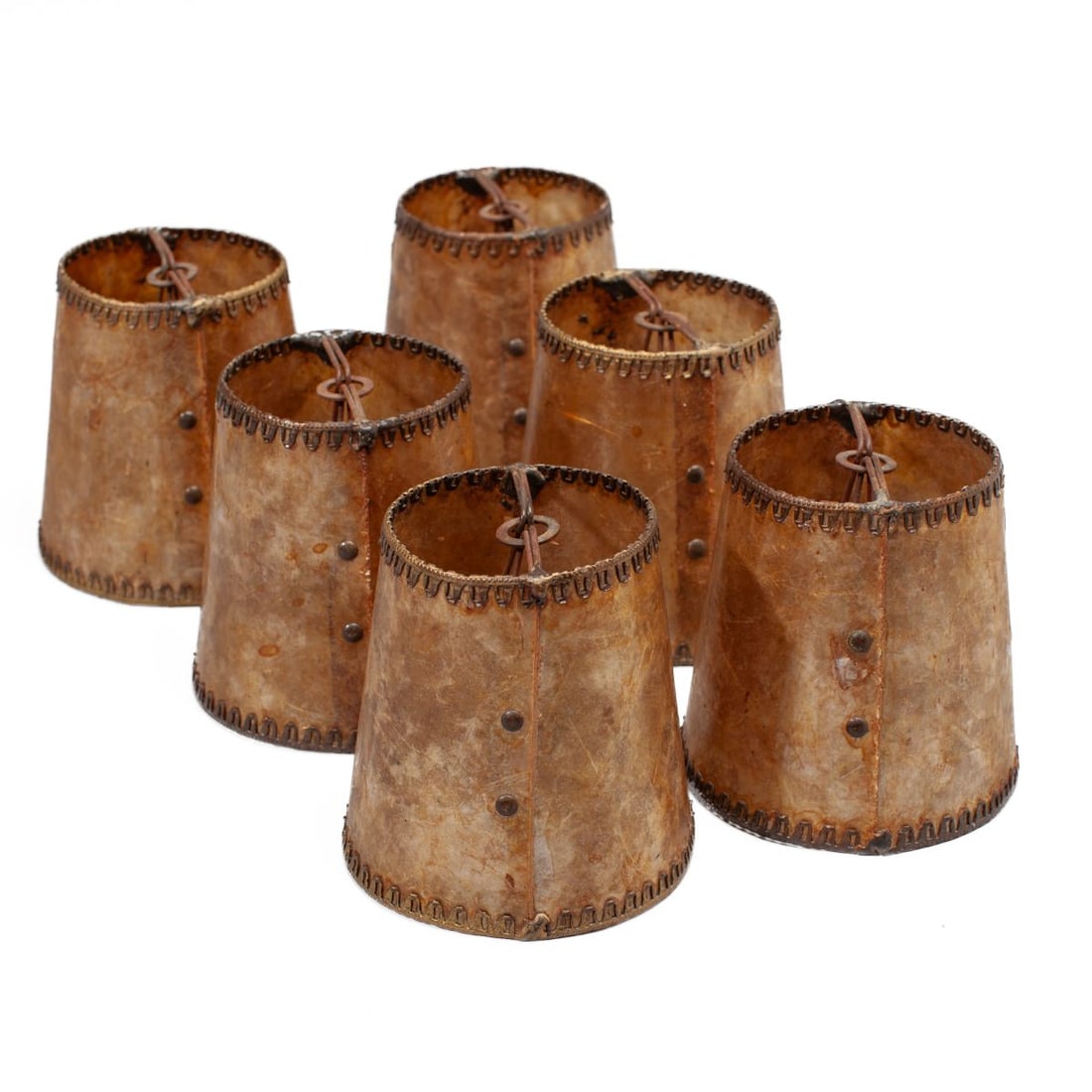 Vintage Mica Sconce Candle Bulb Shades Set 6: Set 6 matching sconce candle bulb shades. Thick conical mica sides with stamped and pierced metal trim to top and bottom edges. All very good condition. 3.75" H. 2.5" dia. tops. 3.5" dia. bottoms.