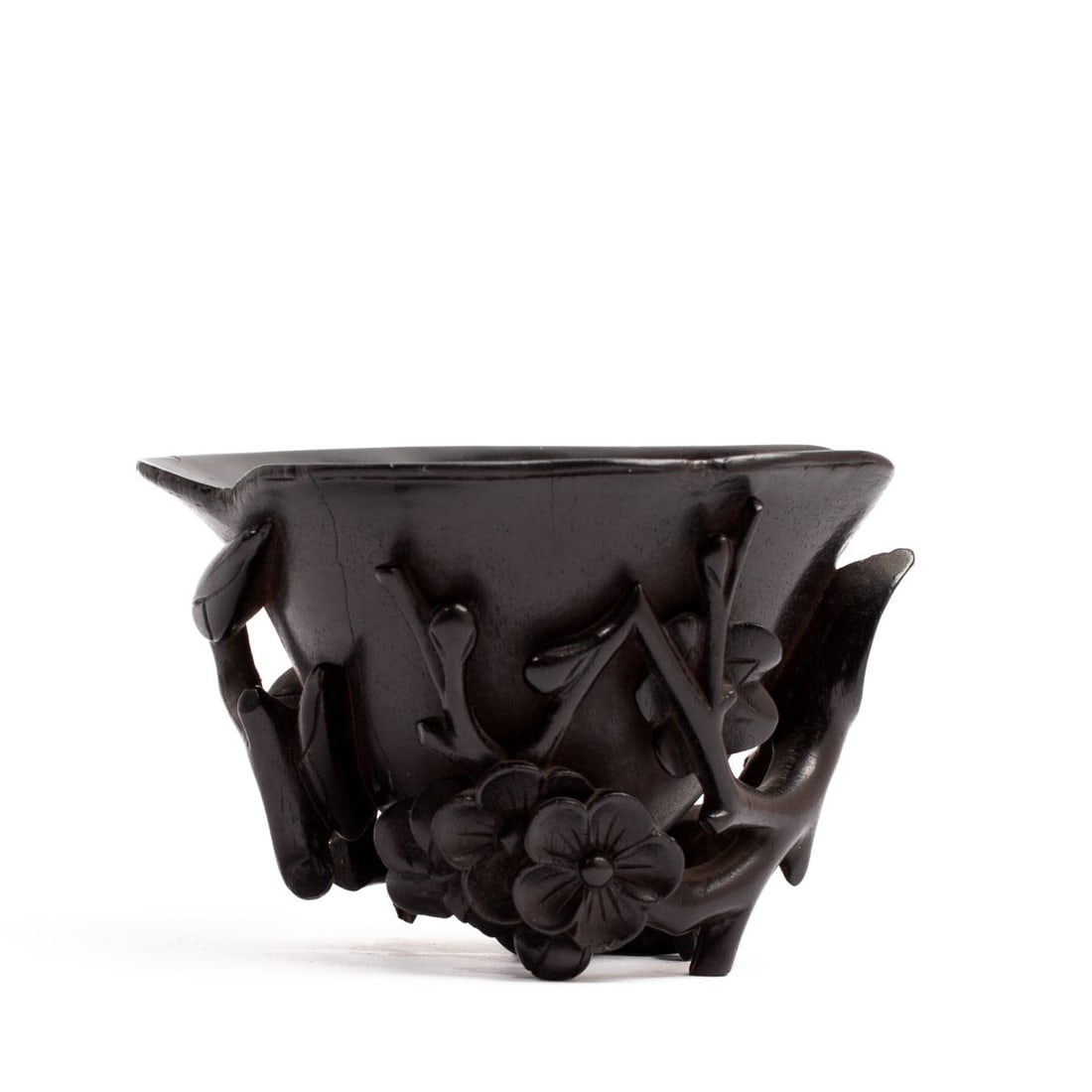 17th Century Chinese Zitan Wood Libation Cup: Antique Chinese zitan wood libation cup with carved relief openwork prunus and magnolia blossoms stemming from a single branch, 17th century. Losses to branch at magnolia blossoms, some edge wear and