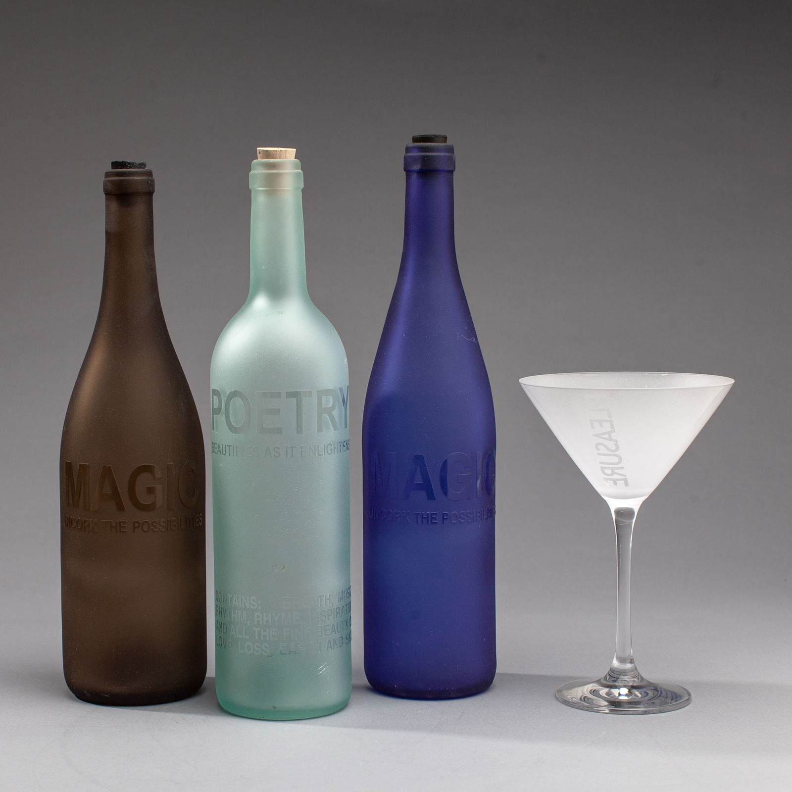Jeff Crandall InVerse Studio Etched Bottles &Glass: Jeff Crandall (b.1964 Washington) InVerse Studio Etched Glass Bottles and Martini Glass, 2000. All signed with either Jeff Crandall or InVerse Studios. Includes 3pc 750ml bottles with "Poetry", and 2p